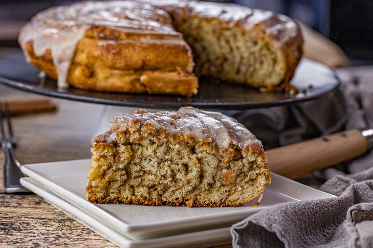 slice of cinnamon roll cake on a white plate