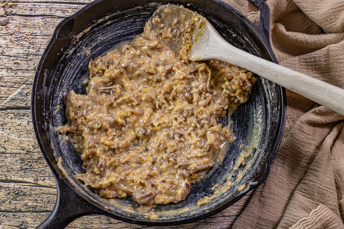 coconut pecan caramel frosting in a cast iron skillet