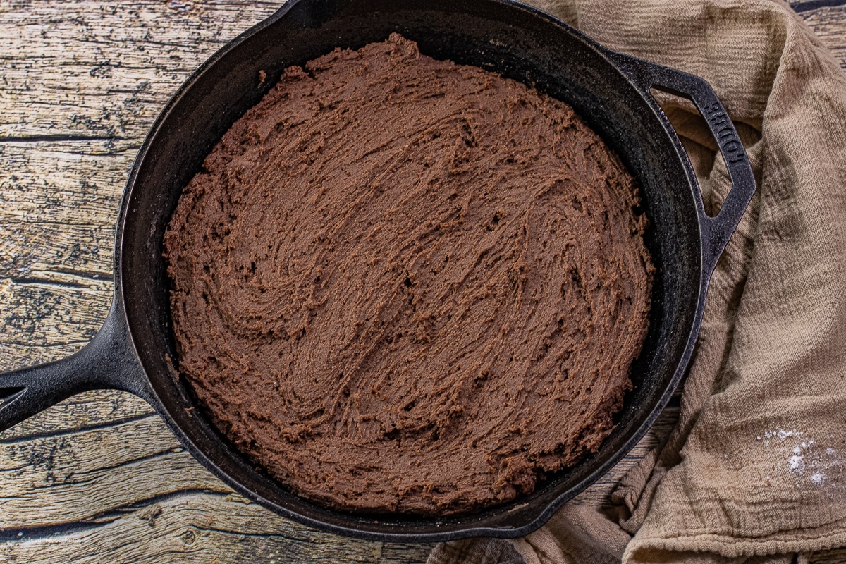 chocolate cookie dough spread in a cast iron skillet