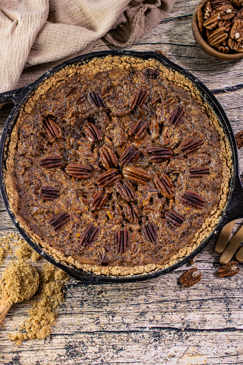 This Cast Iron Skillet Pecan pie is all the gooey goodness of a pecan pie with a different kind of charm because it is baked in a cast iron skillet. Not only does this skillet pie taste amazing, it is the perfect addition to any Holiday table.