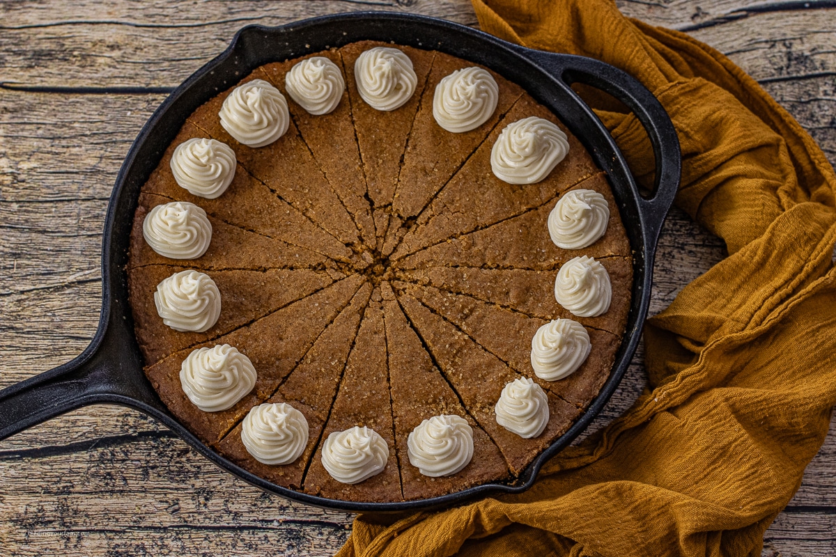 skillet gingerbread cookie with cream cheese frosting swirls