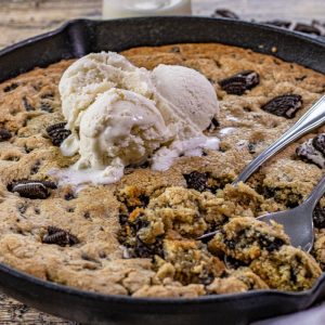 cookies and cream skillet cookie topped with ice cream