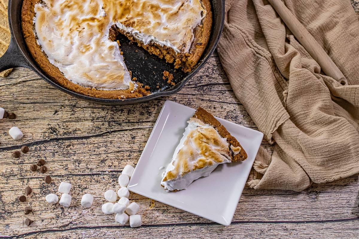 slice of smores skillet cookie topped with toasted marshmallow