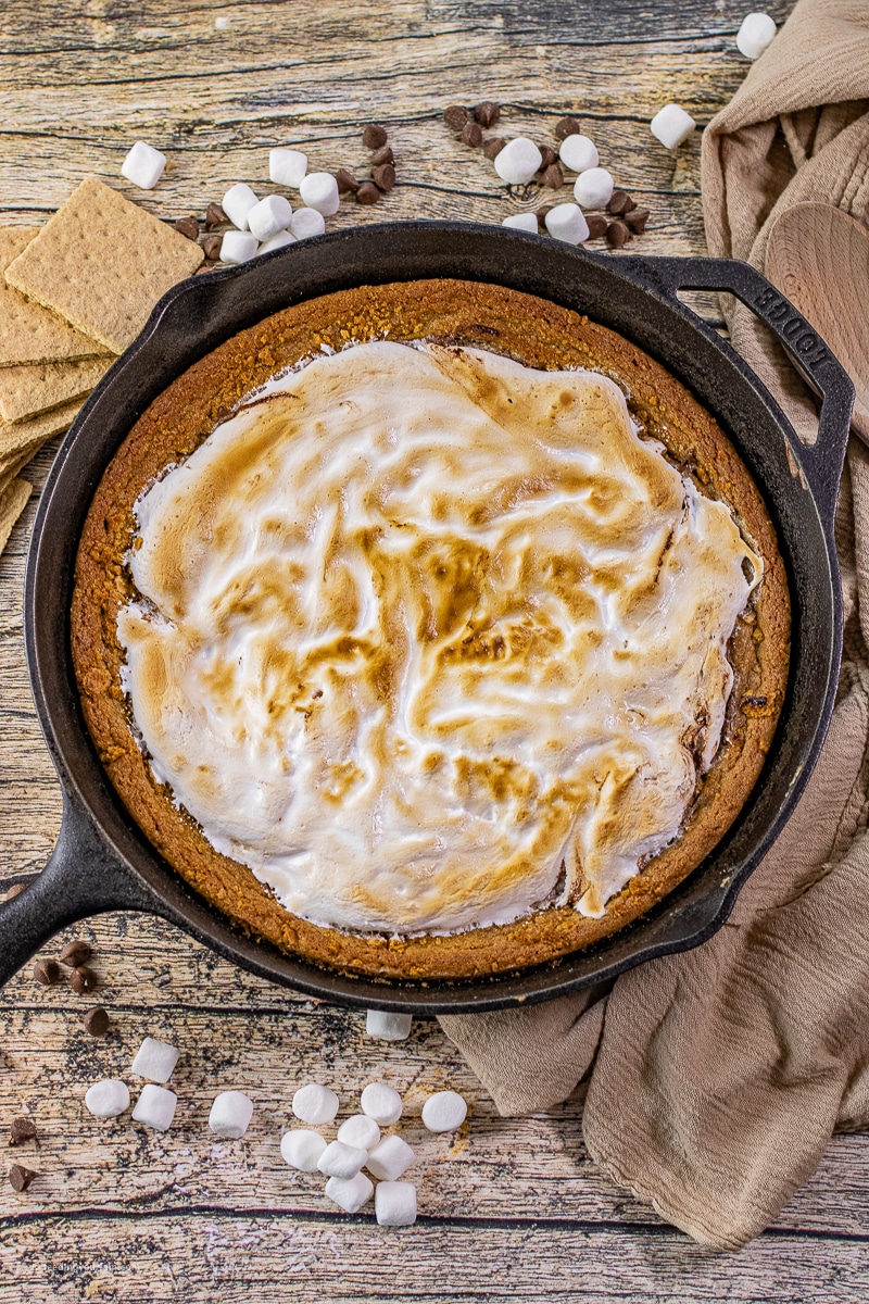 No one can resist the classic combination of chocolate, marshmallows, and graham crackers! Now picture taking those flavors and stacking them into your cast iron skillet to make a delicious Smore's Cookie with a graham cracker cookie base topped with melted chocolate and toasted marshmallows.