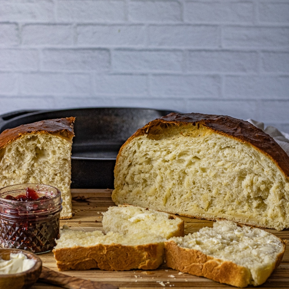 round loaf of white bread on a cutting board