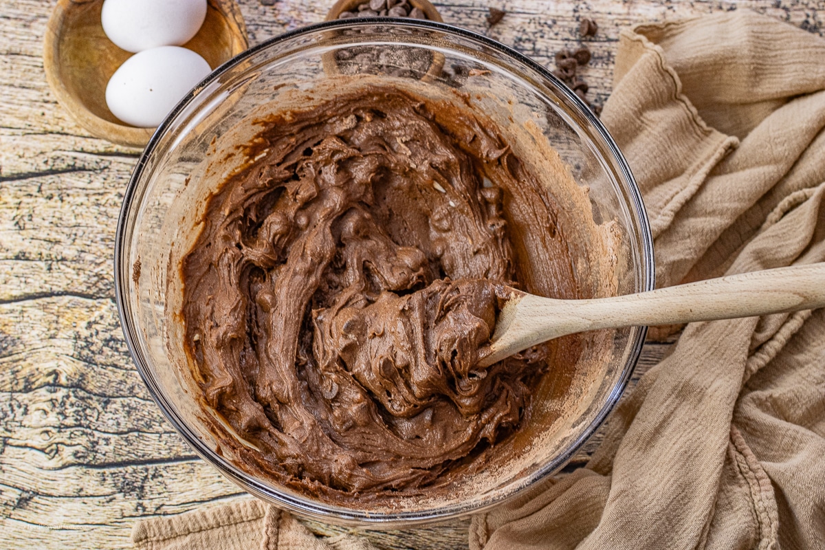 chocolate cookie dough in a glass mixing bowl