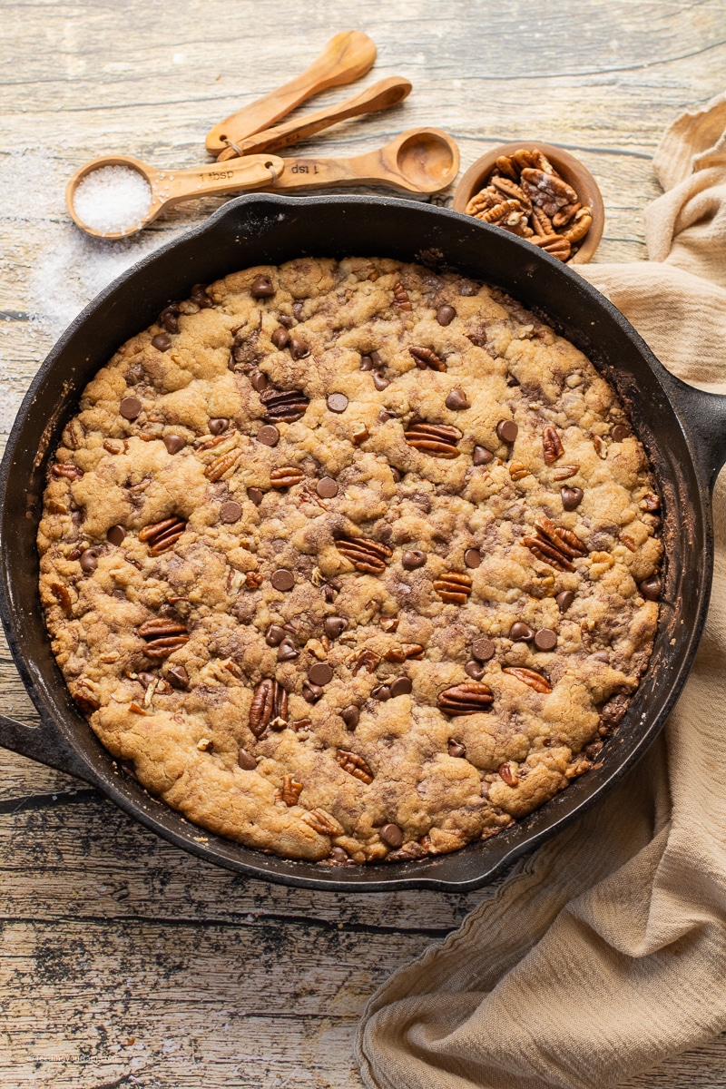 chocolate chip pecan skillet cookie in cast iron pan