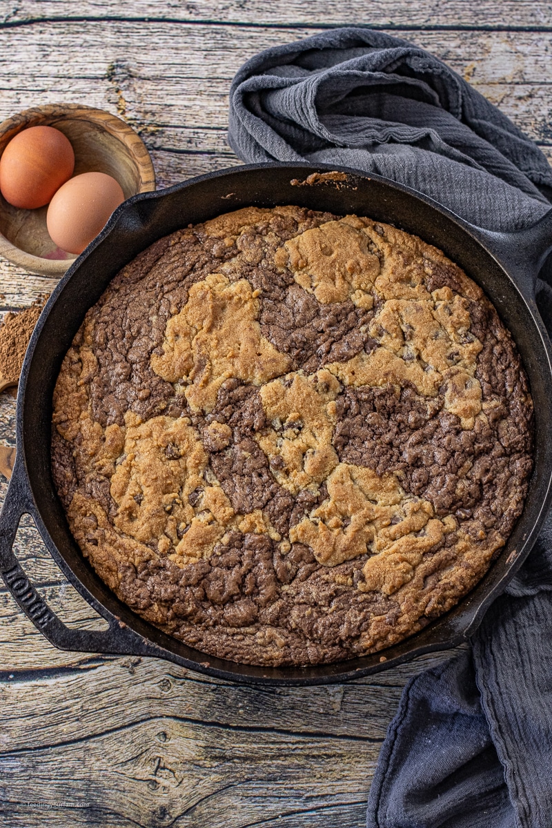 No one can resist the combination of a warm brownie and chocolate chip cookie. This Skillet Brookie Recipe is a rich, chocolatey brownie, mixed with the classic flavor of a chocolate chip cookie all baked in a cast iron pan.