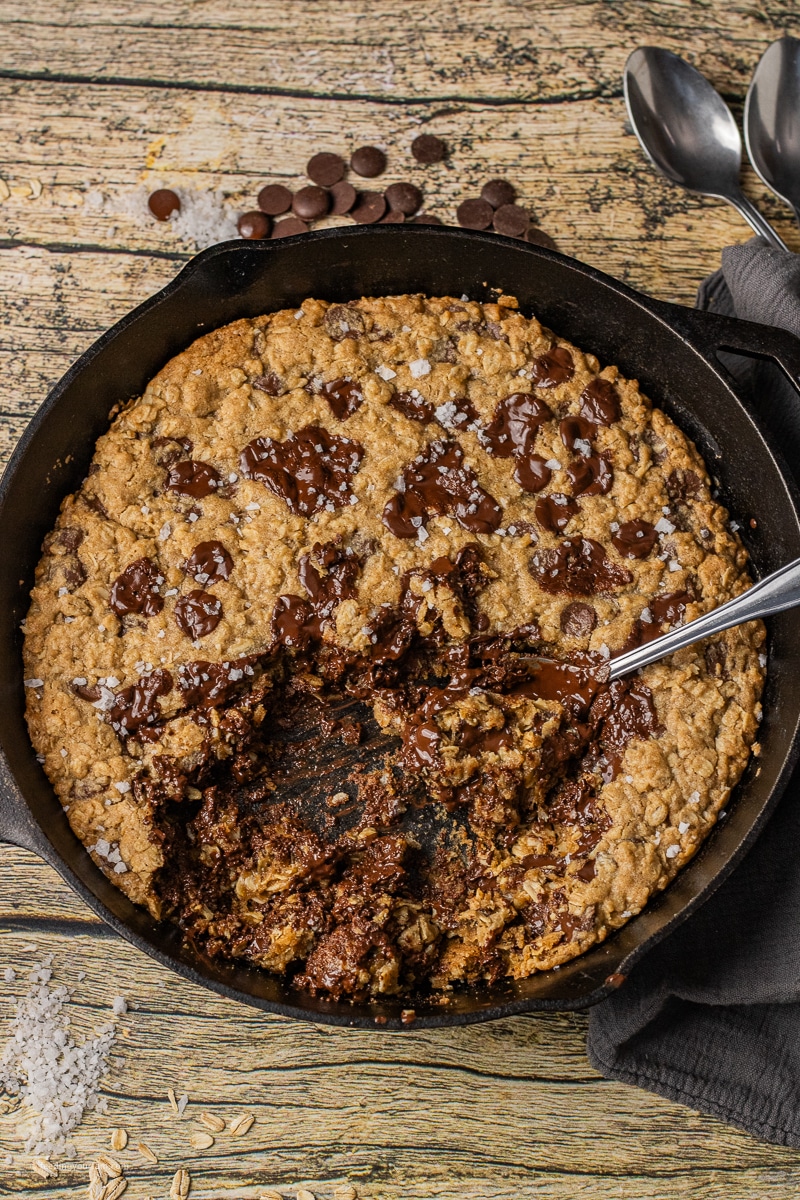 Oatmeal chocolate chip cookie in a cast iron skillet