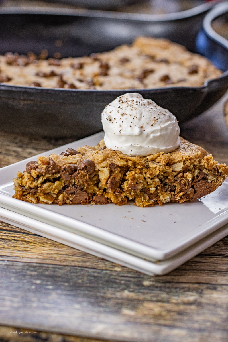 slice of oatmeal chocolate chip cookie on a square plate