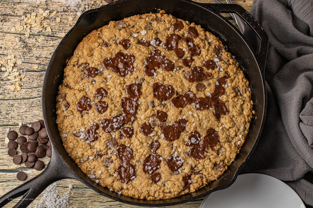 oatmeal chocolate chip skillet cookie in a cast iron skillet