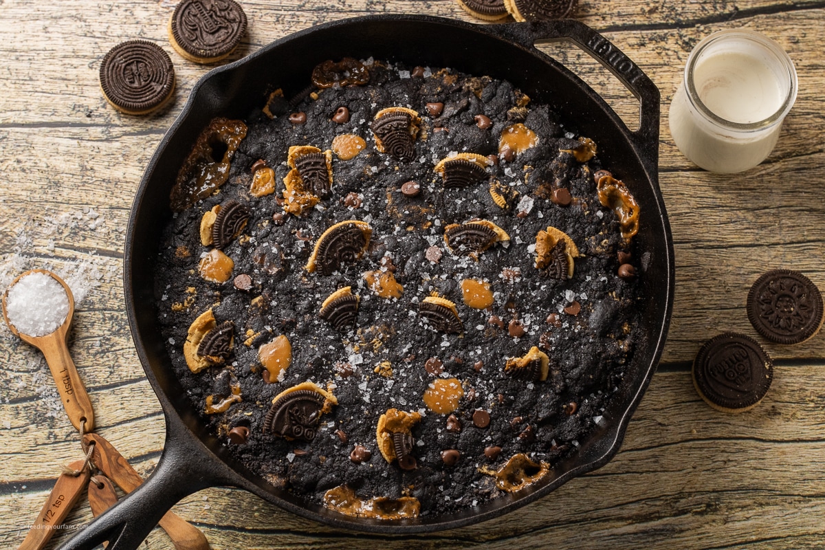 black skillet cookie with Oreos, caramel and chocolate chips