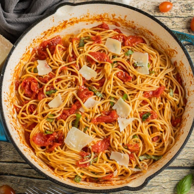 pasta with a cherry tomato sauce in a cast iron skillet