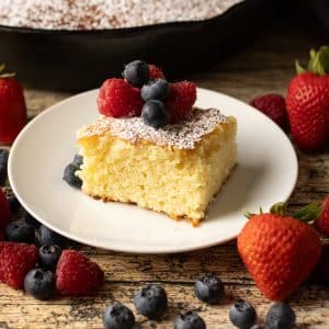 slice of butter cake topped with fresh berries