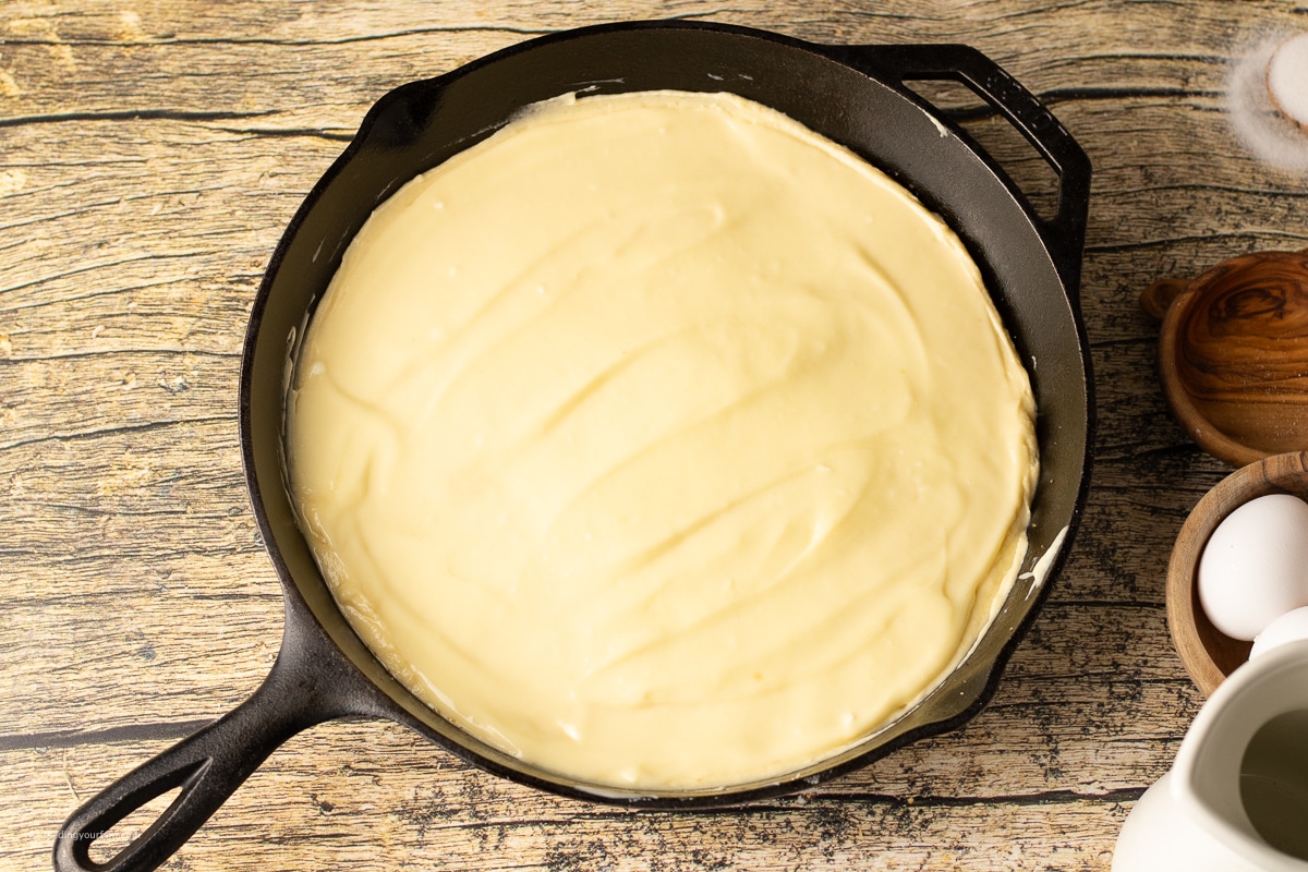 butter cake batter in a cast iron skillet 