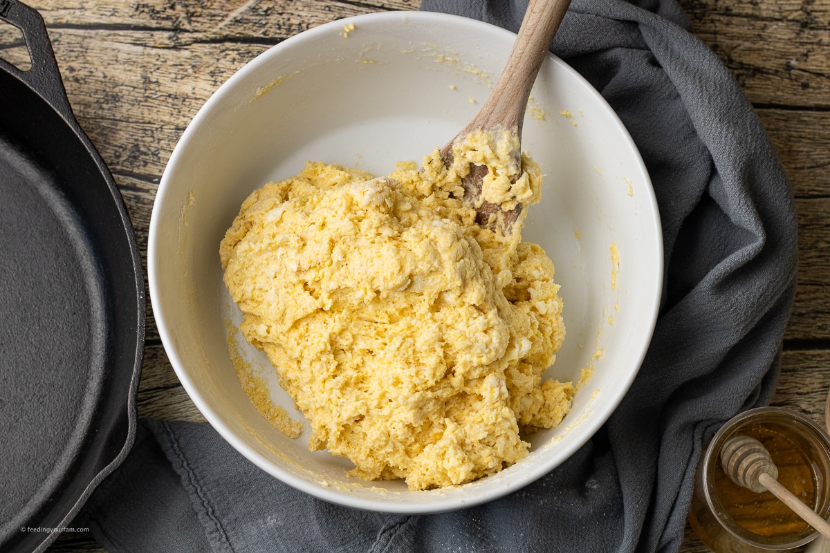 cornbread biscuit mix in a white mixing bowl
