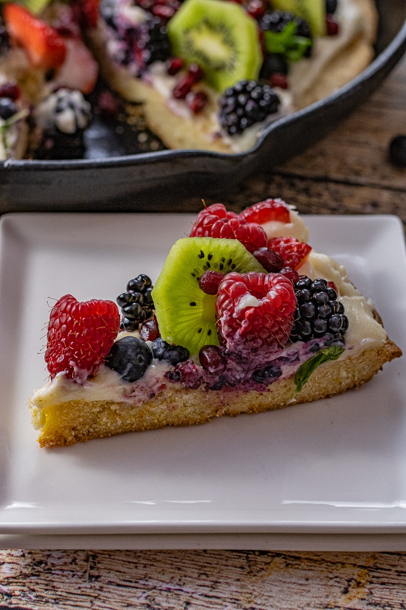 slice of fruit pizza topped with fresh fruit