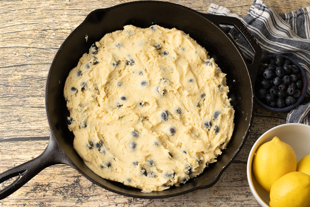 lemon blueberry cookie dough in a cast iron skillet