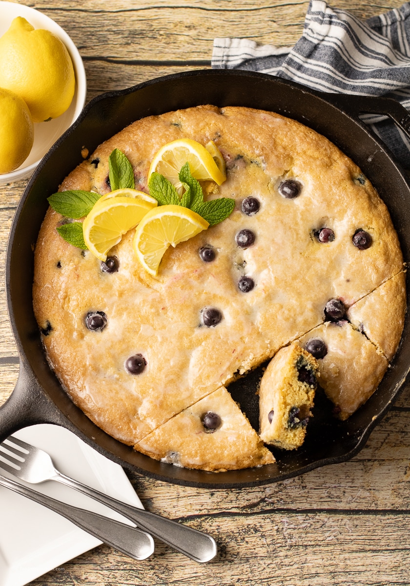 Lemon Blueberry Cookie Baked In Cast Iron is made with a buttery, soft, lemony cookie base filled with fresh blueberries that burst with every bite, this skillet cookie dessert is warm, irresistible and a total show stopper