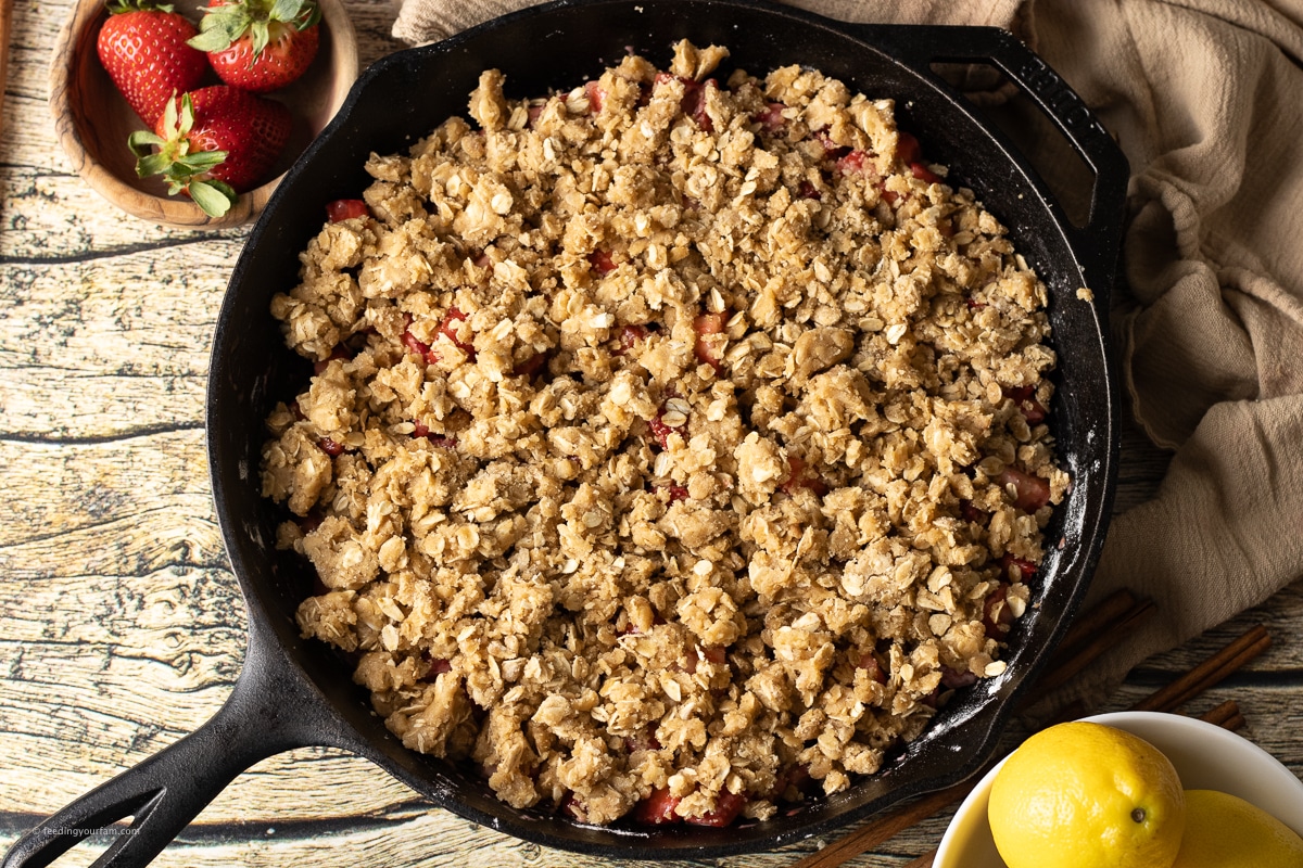 strawberry crisp in a cast iron skillet