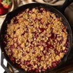 strawberry crumble in a cast iron skillet