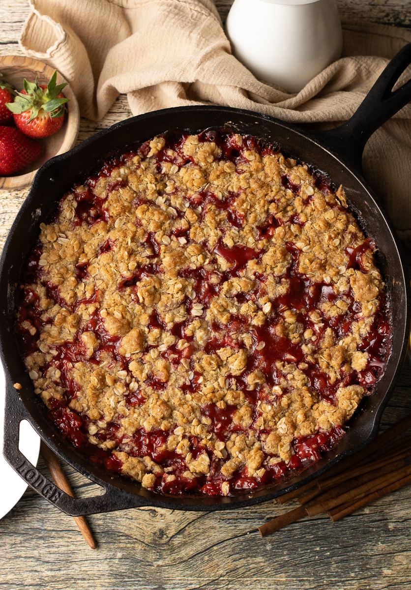 strawberry crumble in a cast iron skillet 