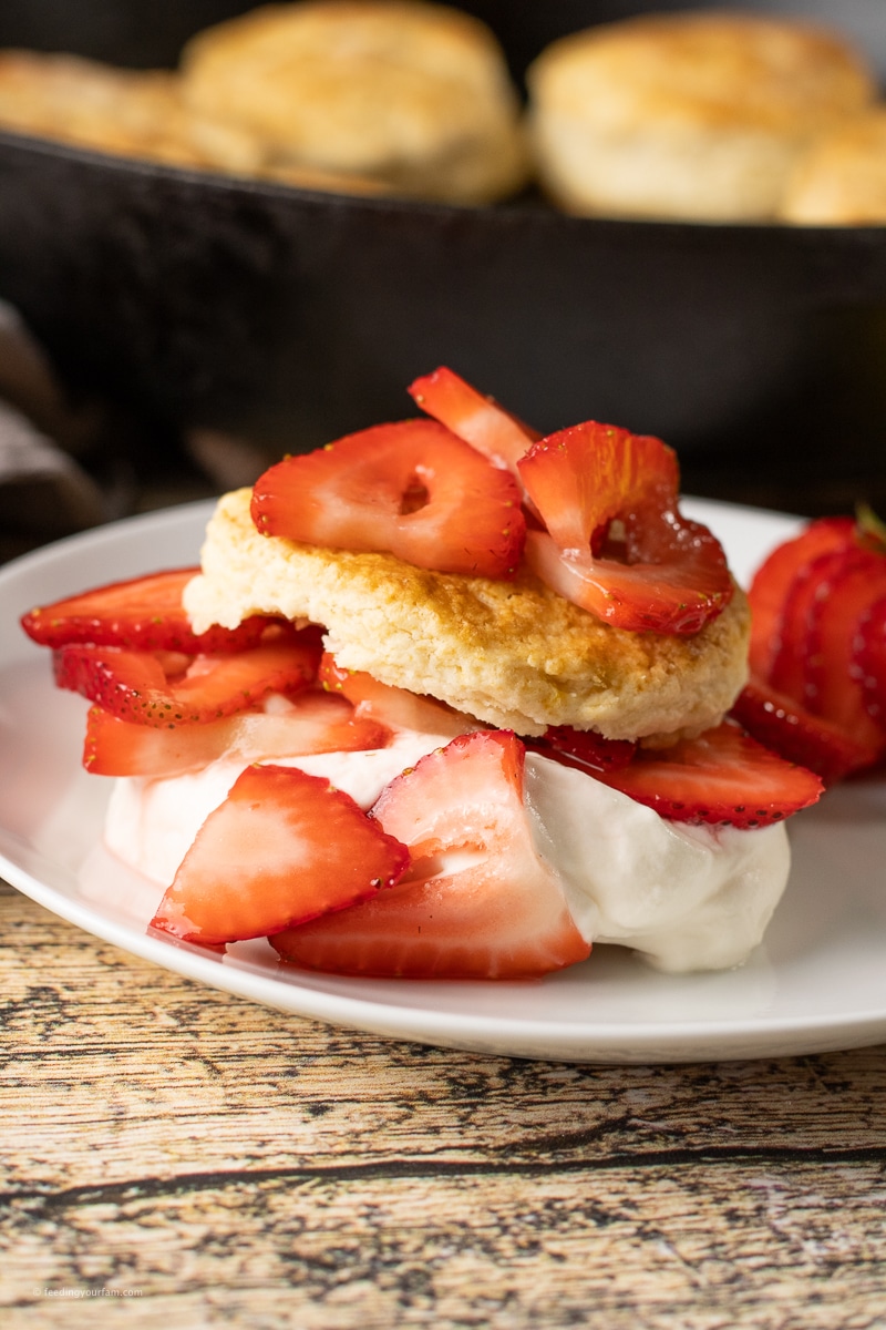 strawberry shortcake biscuits topped with whipped cream and strawberries