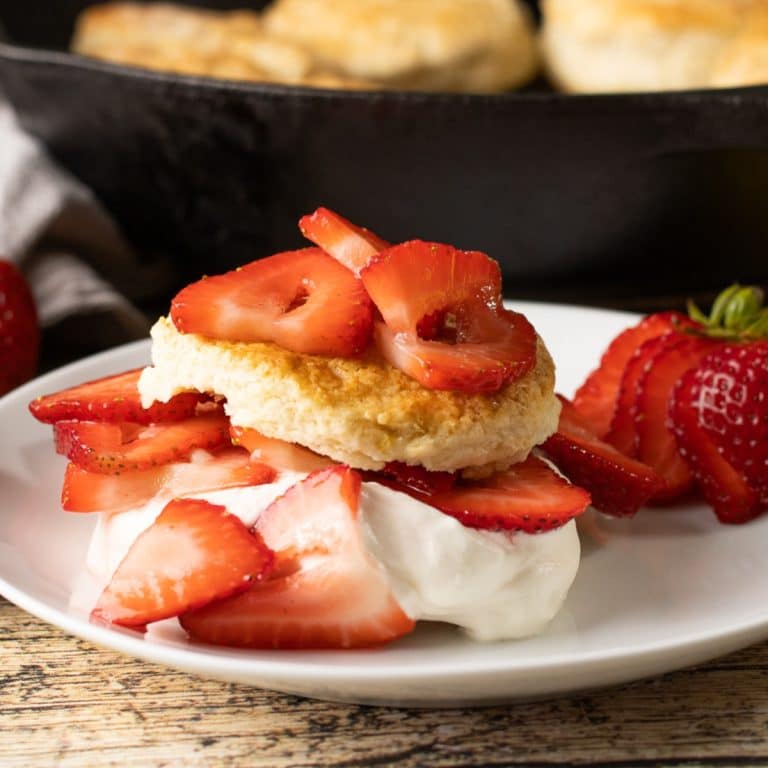 strawberry shortcake biscuits topped with strawberries and whipped cream