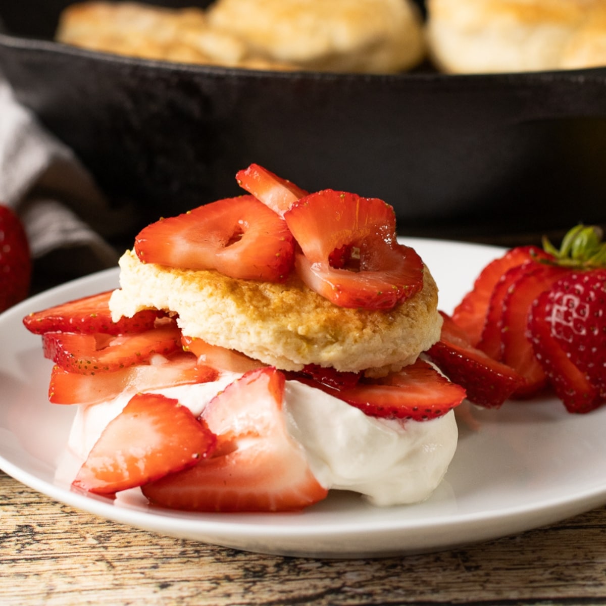 strawberry shortcake biscuits topped with strawberries and whipped cream