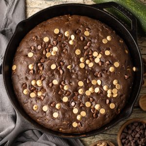 close up of chocolate peanut butter zucchini bread that has been baked in a cast iron skillet