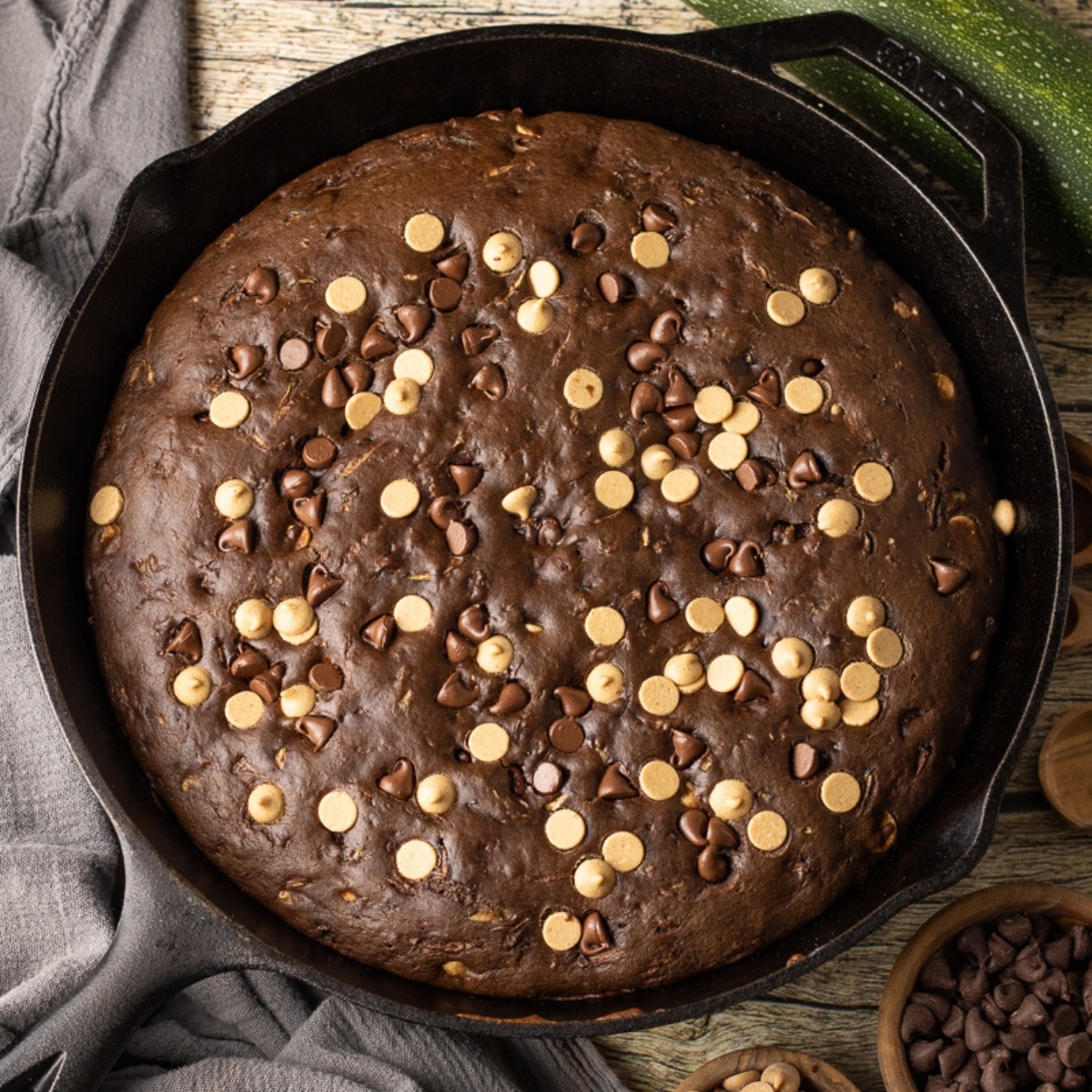 close up of chocolate peanut butter zucchini bread that has been baked in a cast iron skillet