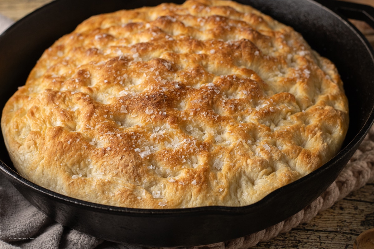 crispy, brown focaccia baked in a cast iron skillet