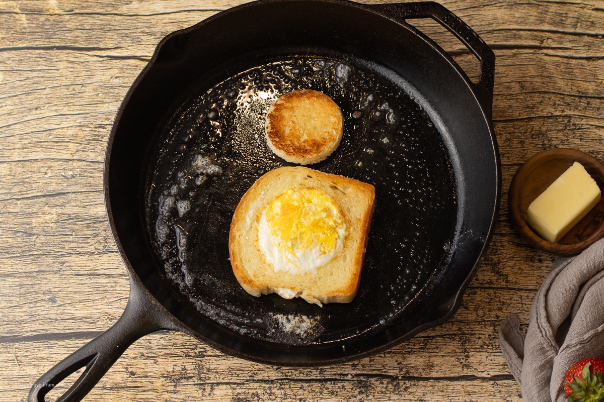 cooked egg in the hole in a cast iron skilet