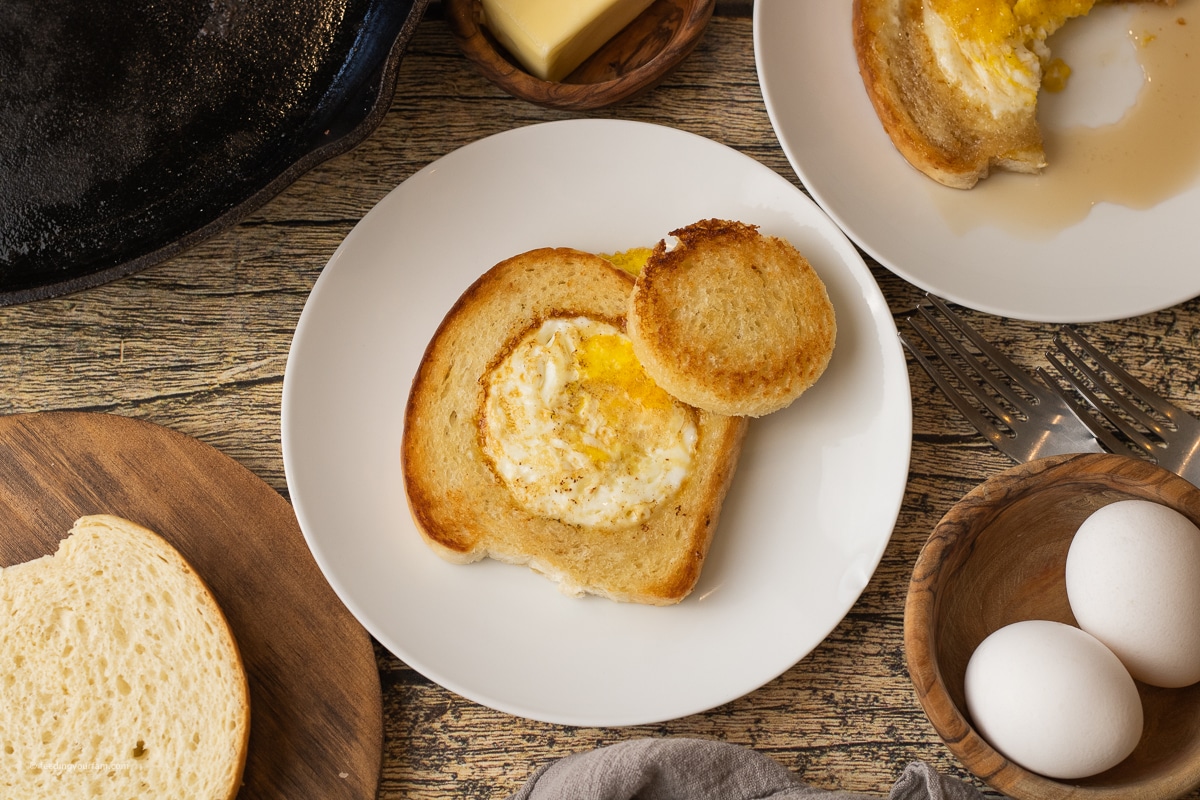 egg cooked in a whole in the center of a piece of white bread