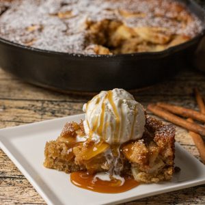 apple cake made with fresh apples and simple spices baked in a cast iron skillet