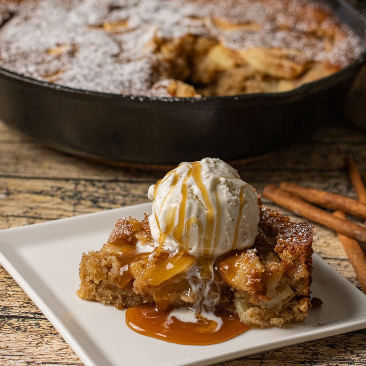 apple cake made with fresh apples and simple spices baked in a cast iron skillet
