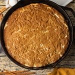 pumpkin cheesecake skillet cookie baked in a cast iron skillet
