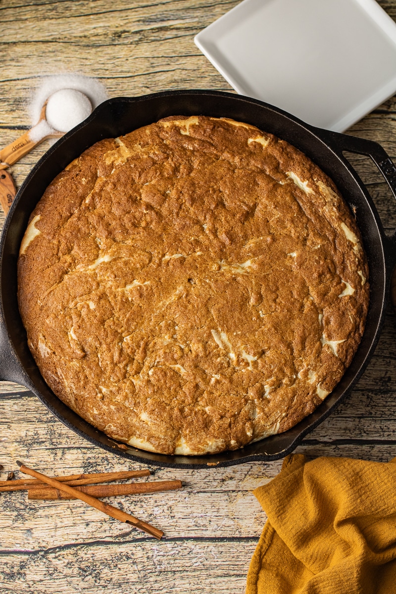 pumpkin cheesecake skillet cookie baked in a cast iron skillet