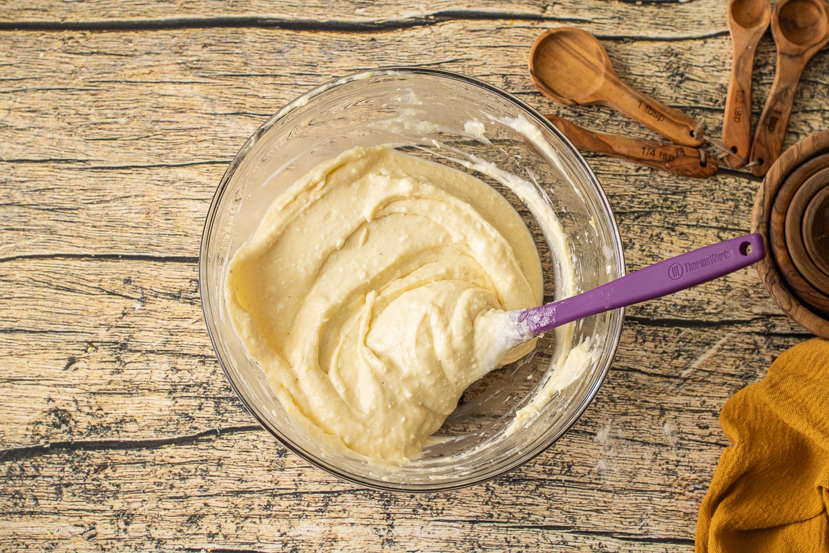 cream cheese, flour, egg, and sugar combined to make a baked cream cheese layer in a pumpkin skillet cookie