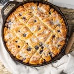 blueberry butter swim biscuits baked in a cast iron skillet