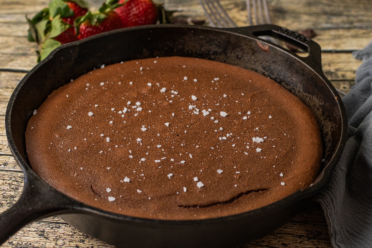 chocolate lava cake in a cast iron skillet