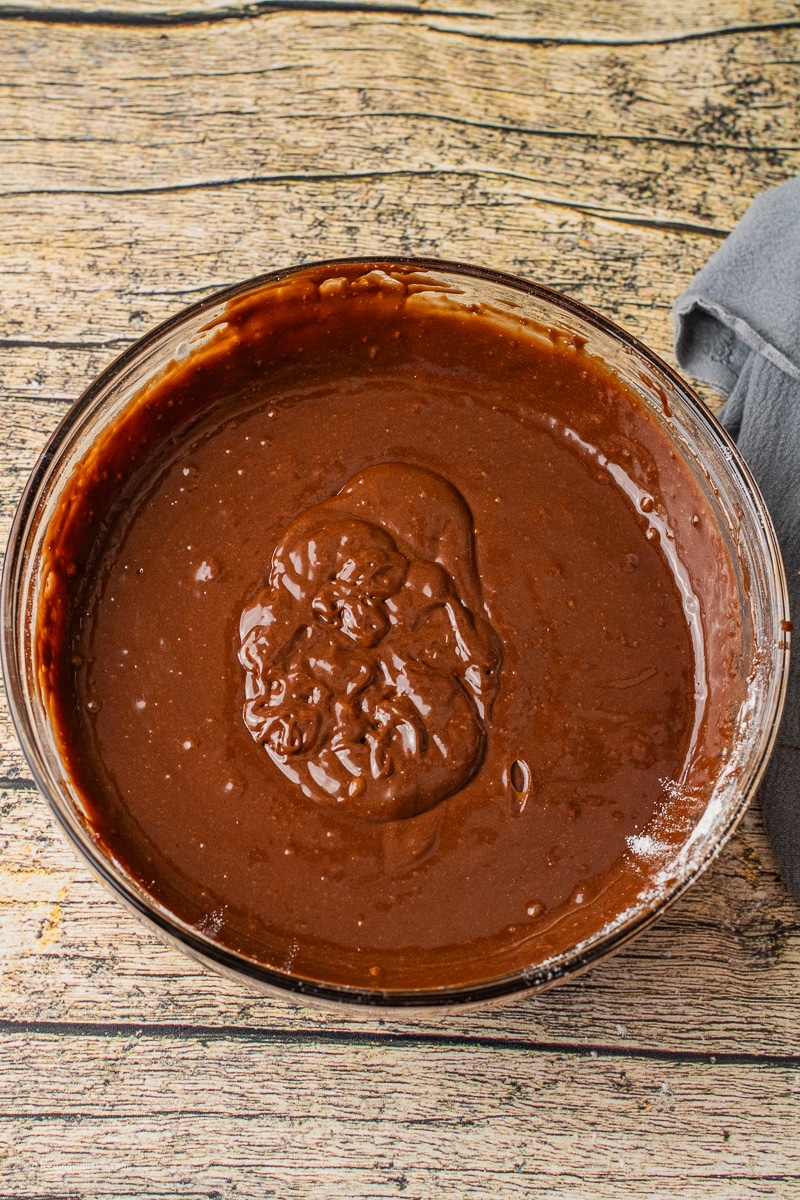 chocolate lava cake batter in a glass mixing bowl