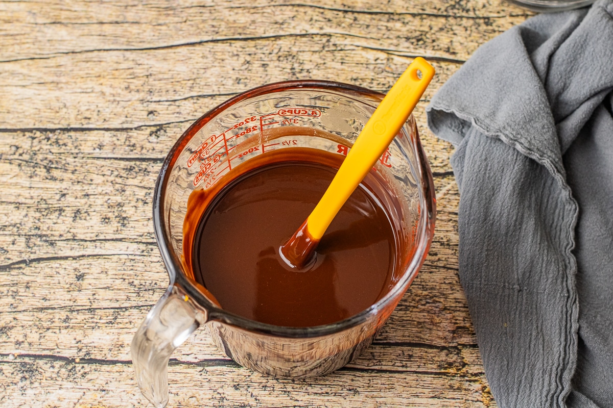 chocolate melted with butter in a glass measuring glass