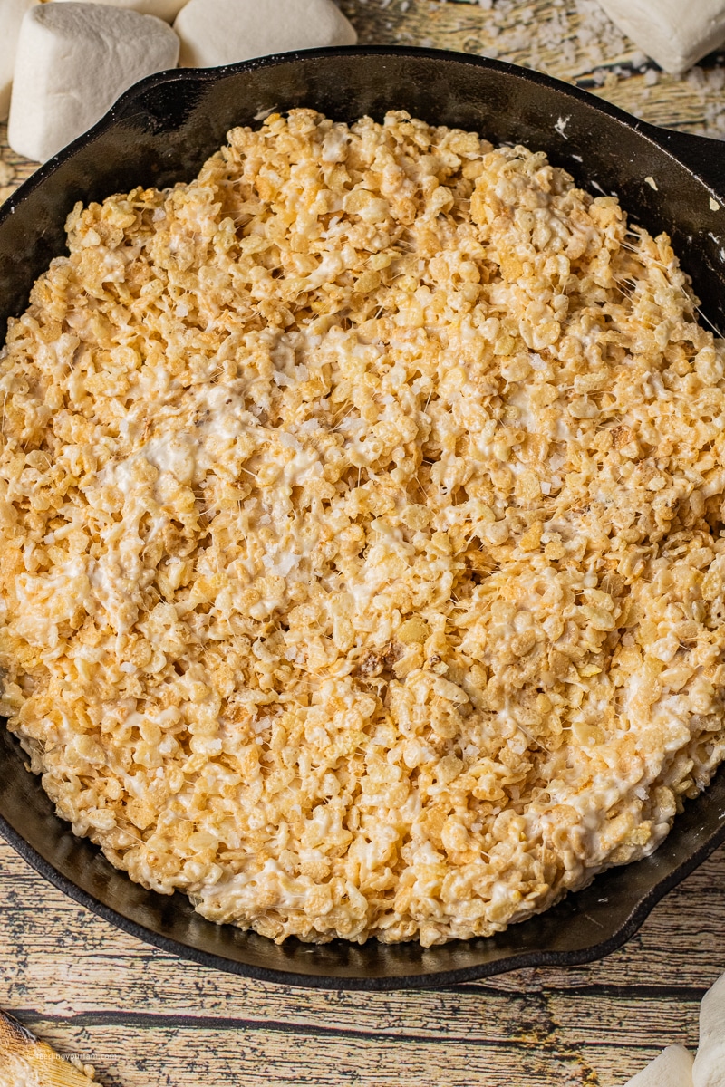 rice krispie treats made with toasted marshmallows in a cast iron skillet