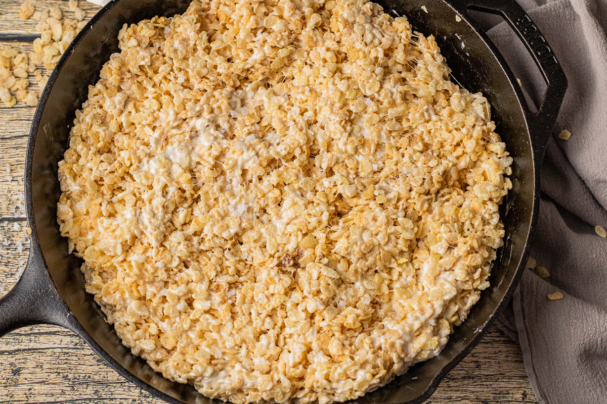 rice krispie treats made with toasted marshmallows in a cast iron skillet