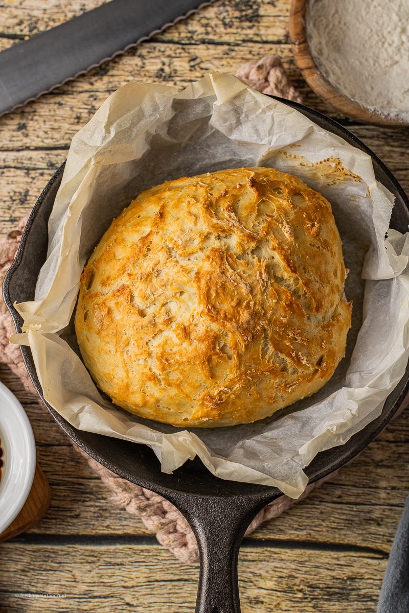 small loaf of bread in a cast iron skillet
