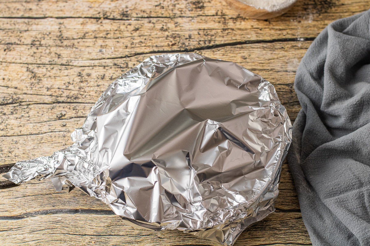 foil covering a small cast iron skillet