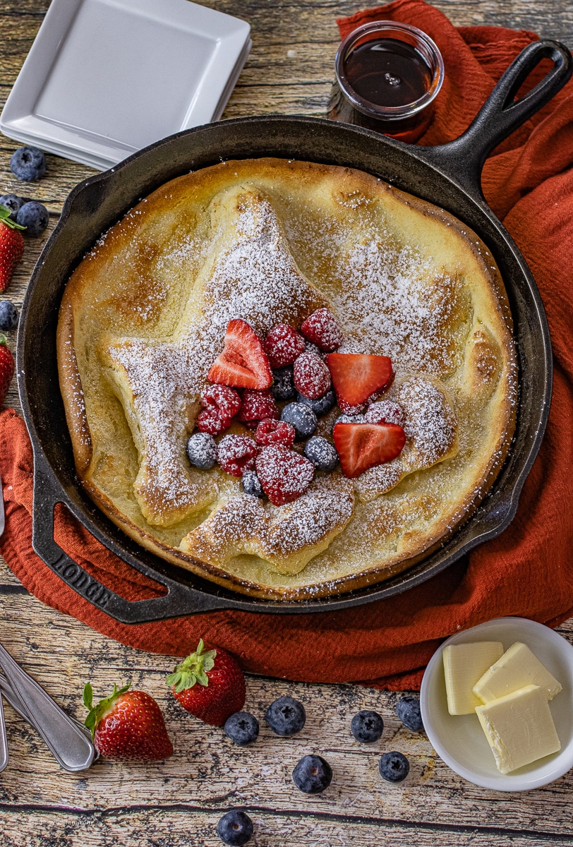 puffy Dutch baby pancake baked in a cast iron skillet