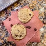 soft chocolate chip cookies on a piece of parchment paper