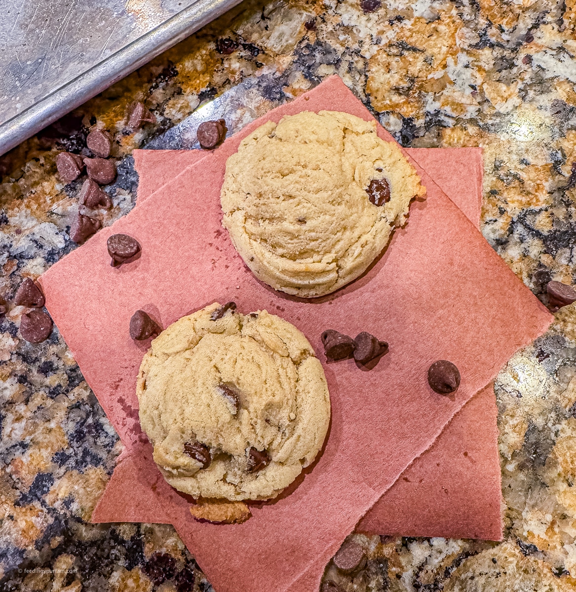 soft chocolate chip cookies on a piece of parchment paper